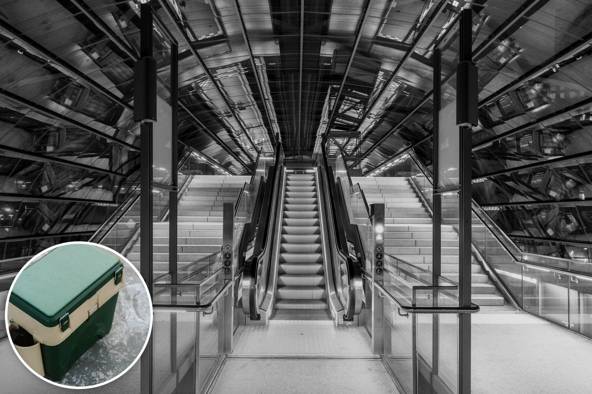 Escalators descend into a modern underground station, with an inset photo of a green picnic cooler box.