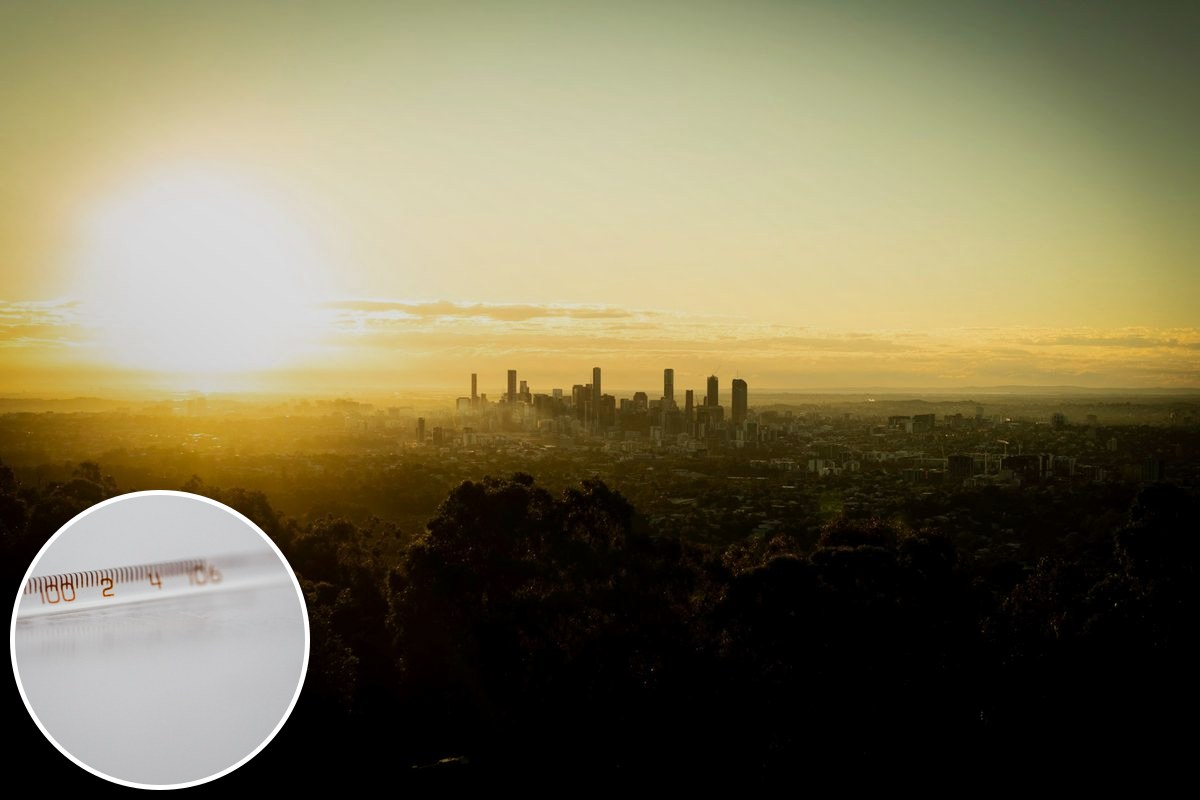 The Brisbane skyline at golden hour under a low, bright sun.