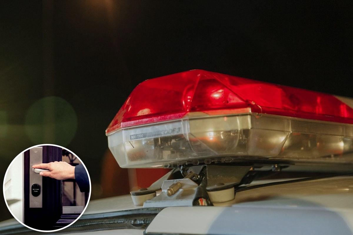 Close-up of a police vehicle's red emergency light bar at night.